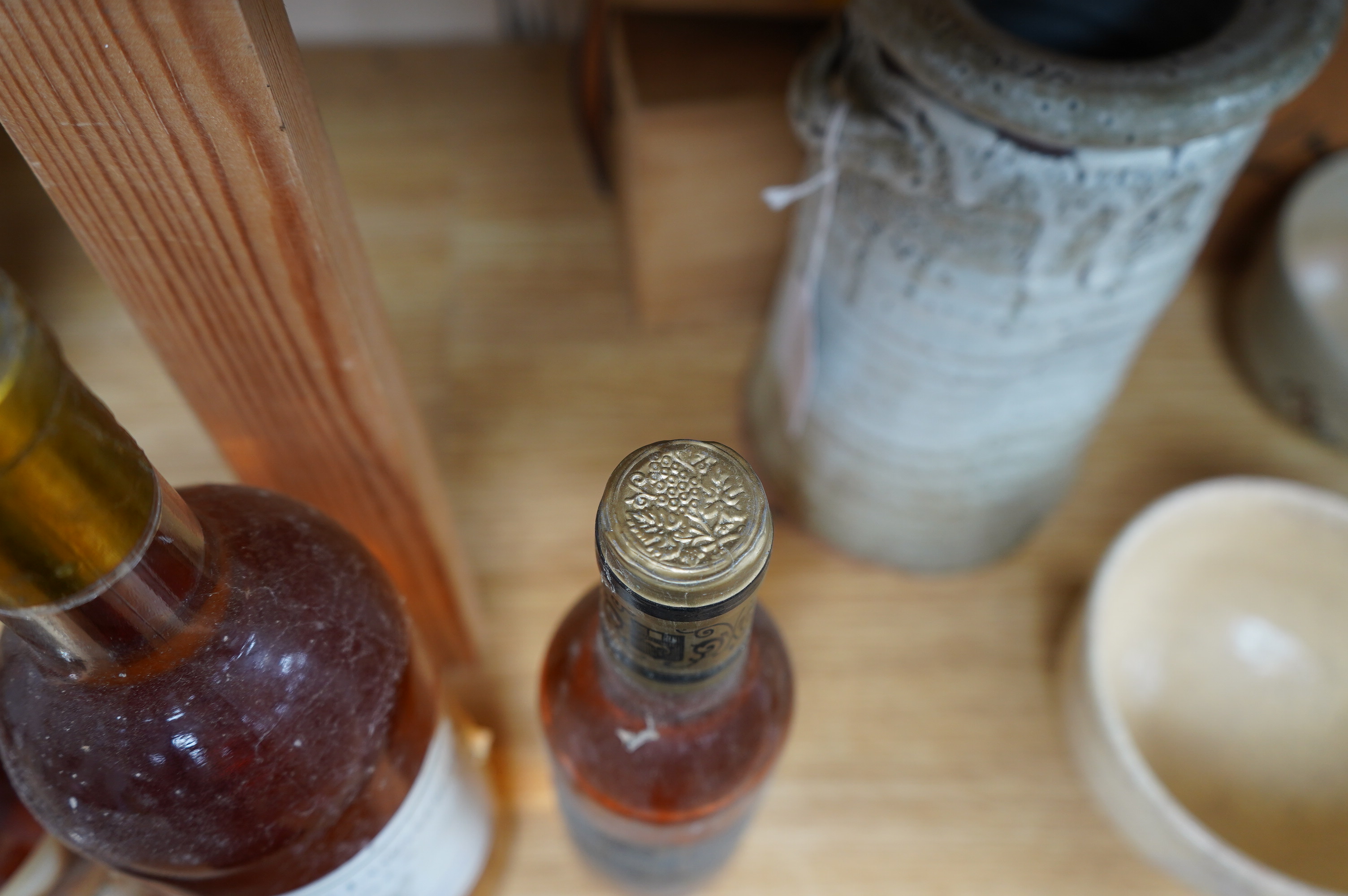 Wine: a bottle of French Sauternes and two half bottles comprising a bottle of Chateau Bastor - Lamontagne 1986, a half bottle of Chateau Guiraud Ist Cru 1983 with another half bottle of Chateau Lafaurie - Peyraguey 1996